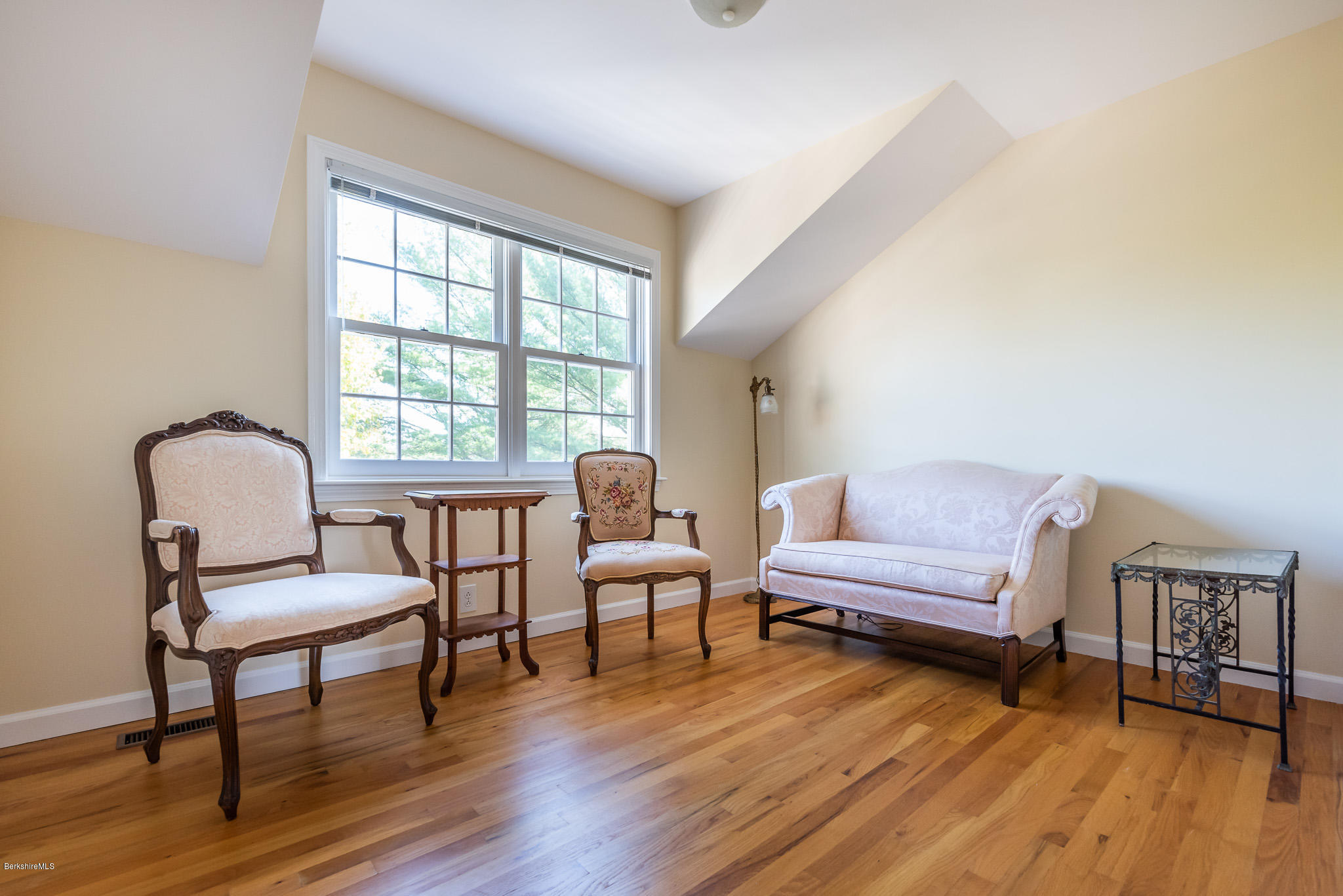 1136 Barker Road, Unit 28 Pittsfield, MA 01201 - Photo 21 of 34 a living room with furniture and a wooden floor