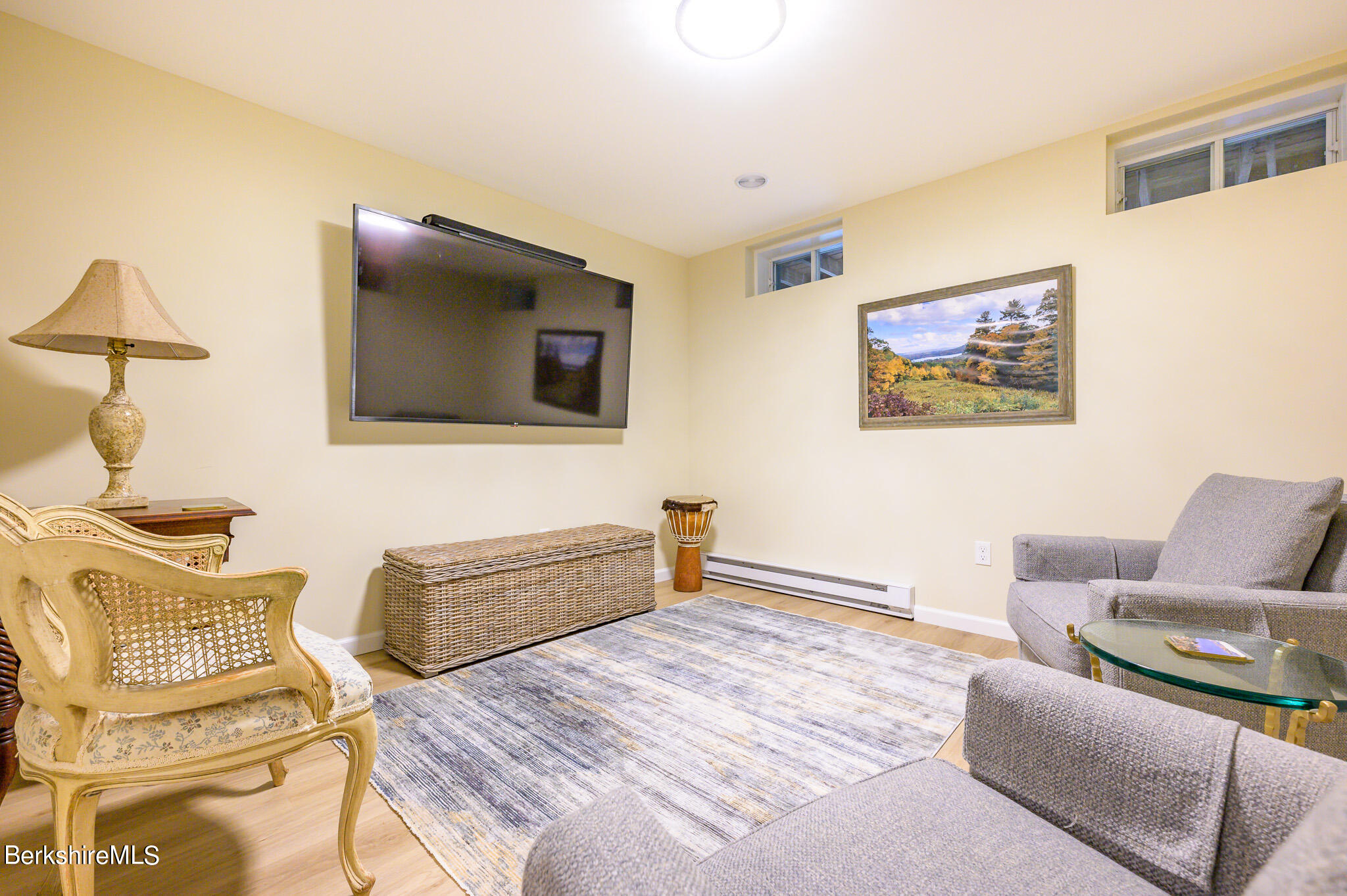 1136 Barker Road, Unit 28 Pittsfield, MA 01201 - Photo 24 of 34 a bedroom with furniture and a flat screen tv