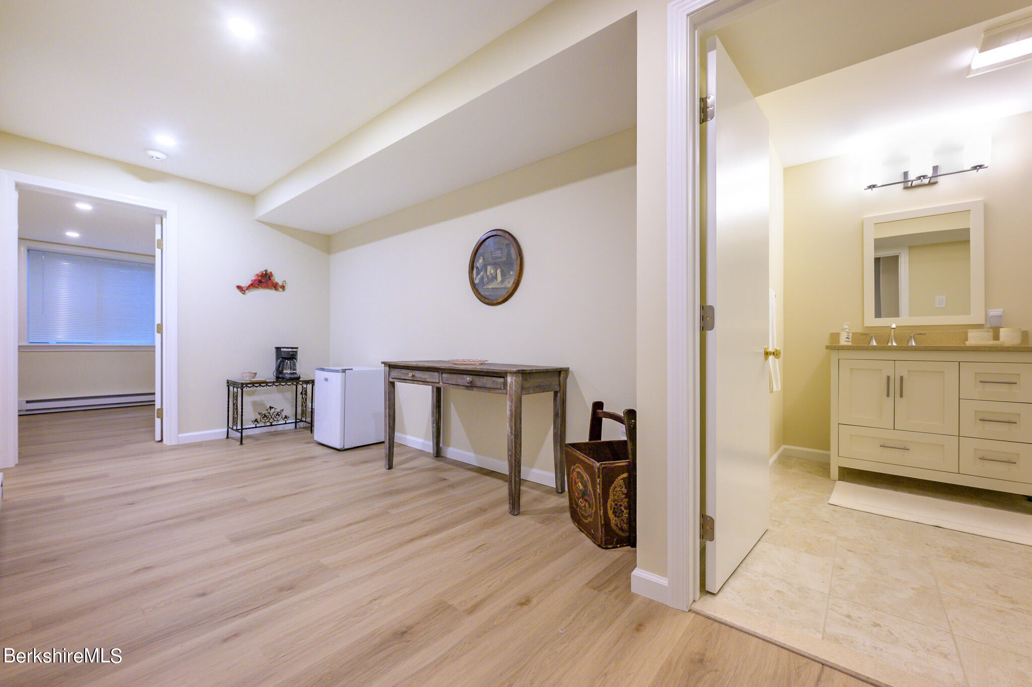 1136 Barker Road, Unit 28 Pittsfield, MA 01201 - Photo 26 of 34 a view of a hallway with wooden floor