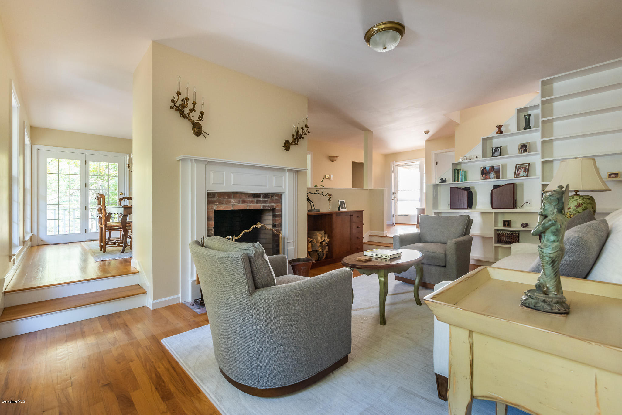 1136 Barker Road, Unit 28 Pittsfield, MA 01201 - Photo 7 of 34 a living room with furniture and a fireplace