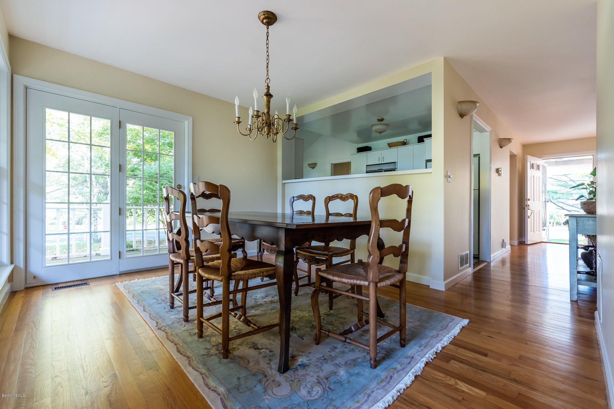 1136 Barker Road, Unit 28 Pittsfield, MA 01201 - Photo 9 of 34 a view of a dining room with furniture window and wooden floor