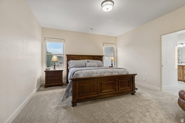 2925 Juniper Road Enterprise, UT 84725 - Photo 20 of 56 Bedroom with light carpet and baseboards