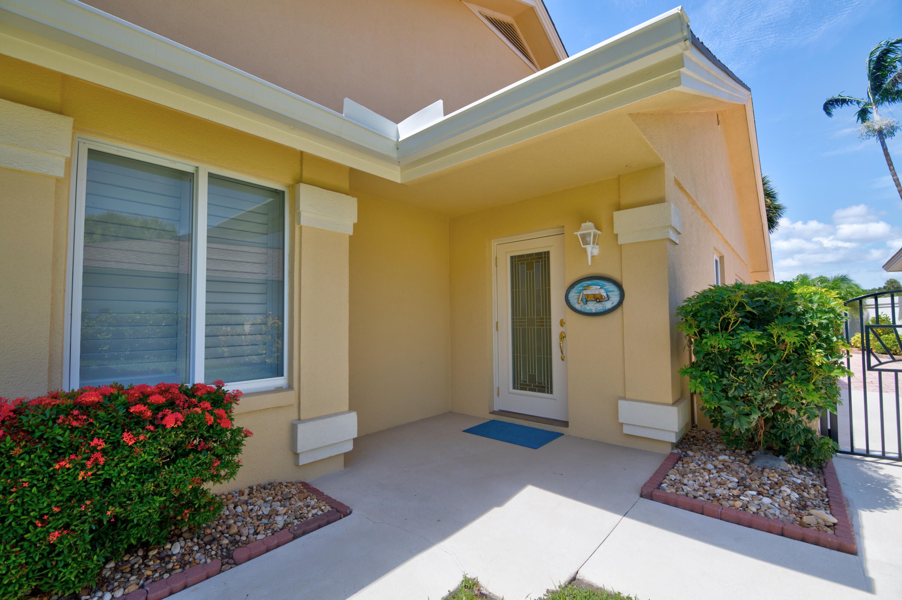 114 Beach Summit Court Jupiter, FL 33477 - Photo 9 of 97 a front view of a house with garden