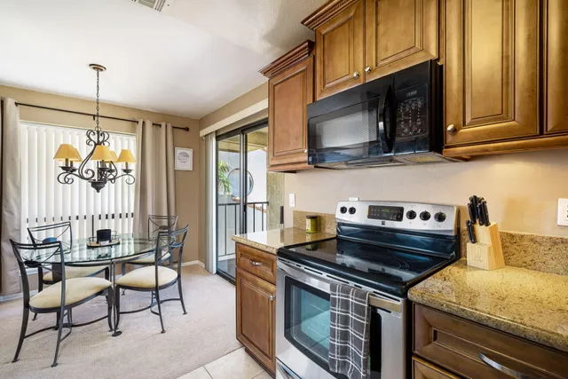 a kitchen with a stove and a microwave