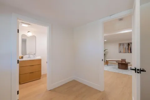 a bathroom with a sink toilet and mirror
