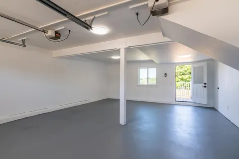 an aerial view of a city with lake view