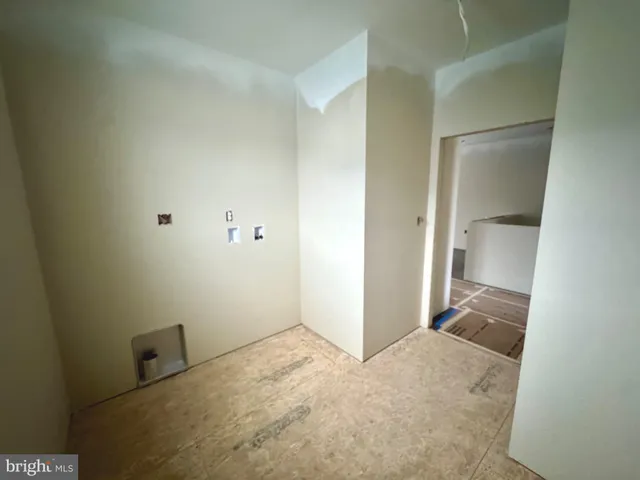 an empty room with an entryway door