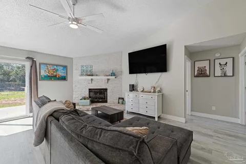 a bed room with furniture and a flat screen tv