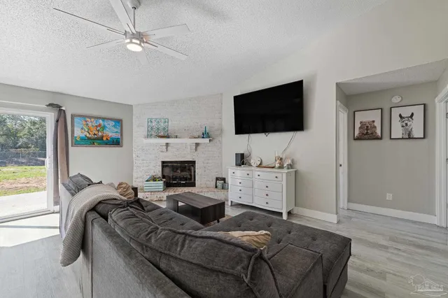 a bed room with furniture and a flat screen tv