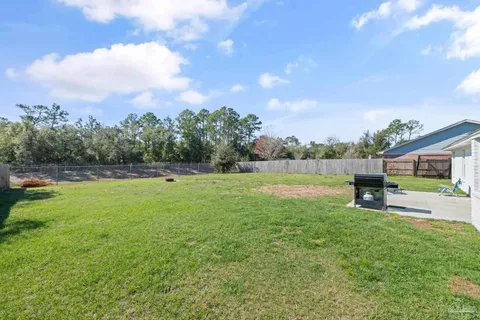 a view of outdoor space with garden and deck