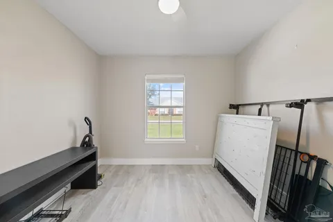 a view of room with window and hardwood floor