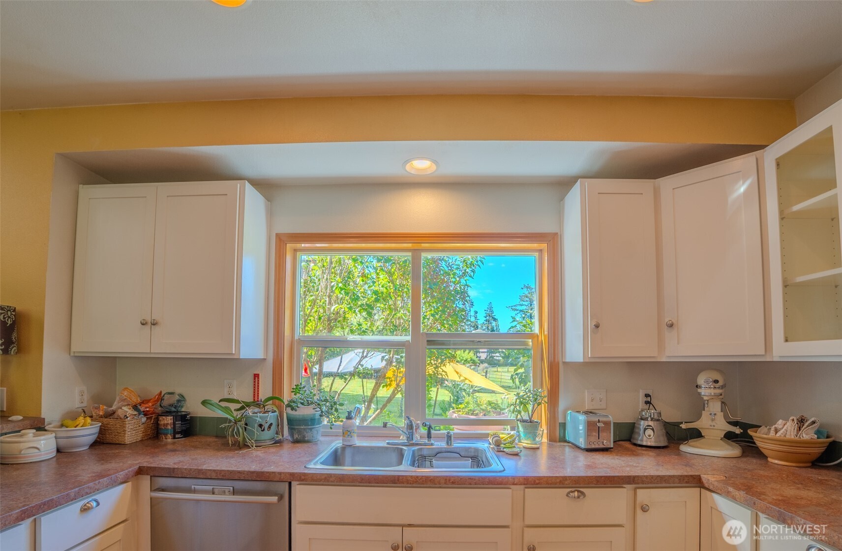 5178 Orcas Road Orcas Island, WA 98245 - Photo 6 of 37 a kitchen with a sink a microwave and cabinets