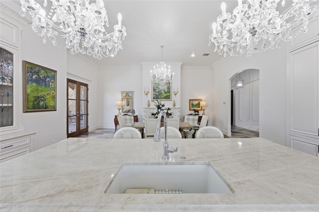 501 Upper Denton Road Weatherford, TX 76085 - Photo 13 of 40 Expansive island featuring an undermount sink and polished faucet