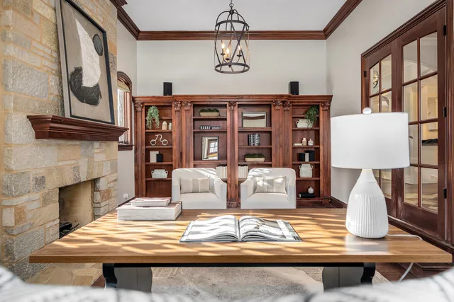a view of a livingroom with stairs and furniture