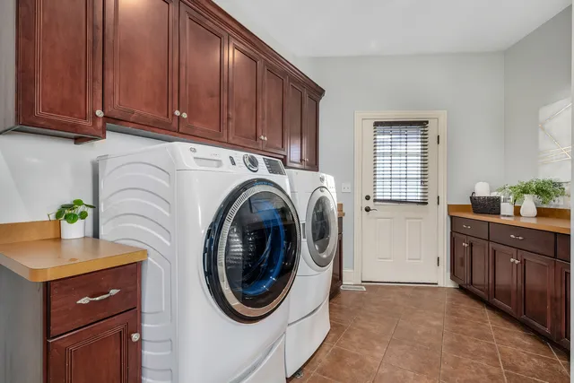 a bedroom with a bed and a large mirror