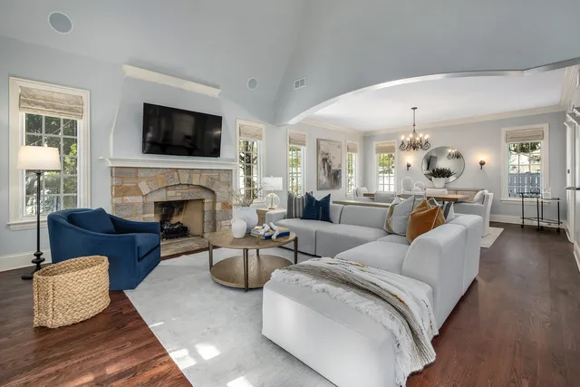 a living room with furniture fireplace and flat screen tv