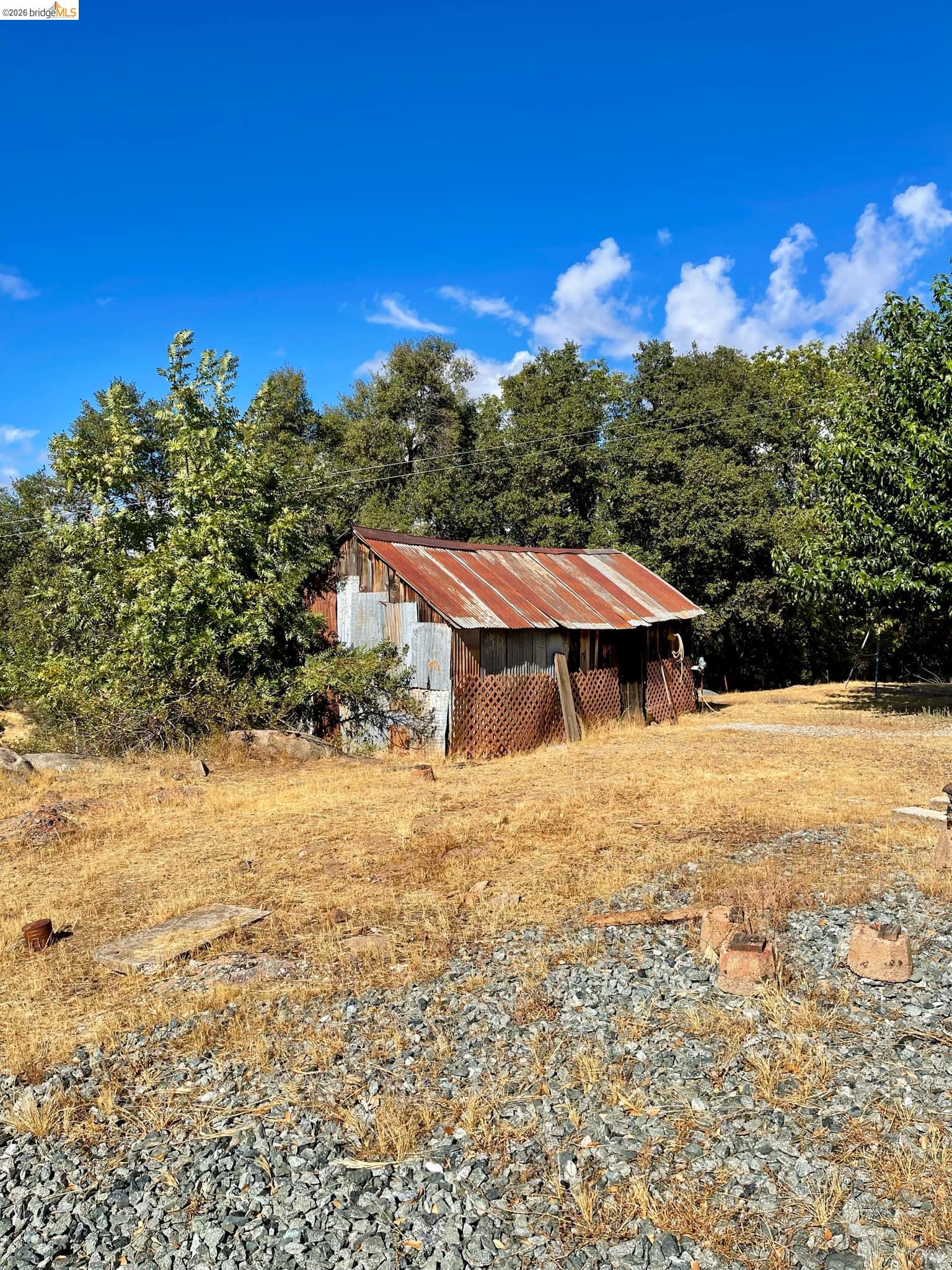 19361 Cherokee Road Tuolumne, CA 95379 - Photo 38 of 41 a view of a house with a yard