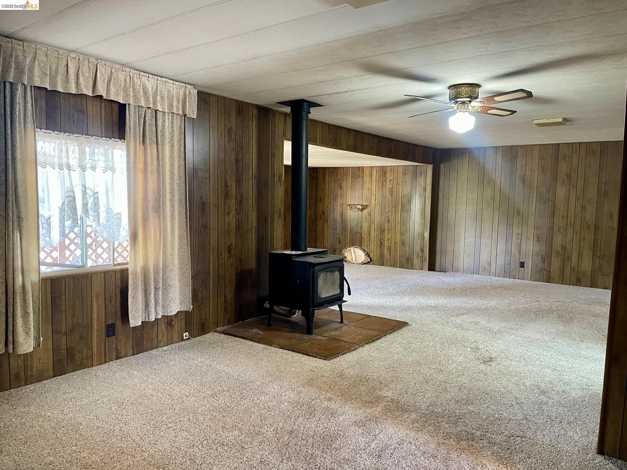 19361 Cherokee Road Tuolumne, CA 95379 - Photo 7 of 41 a living room with a chandelier furniture and a window