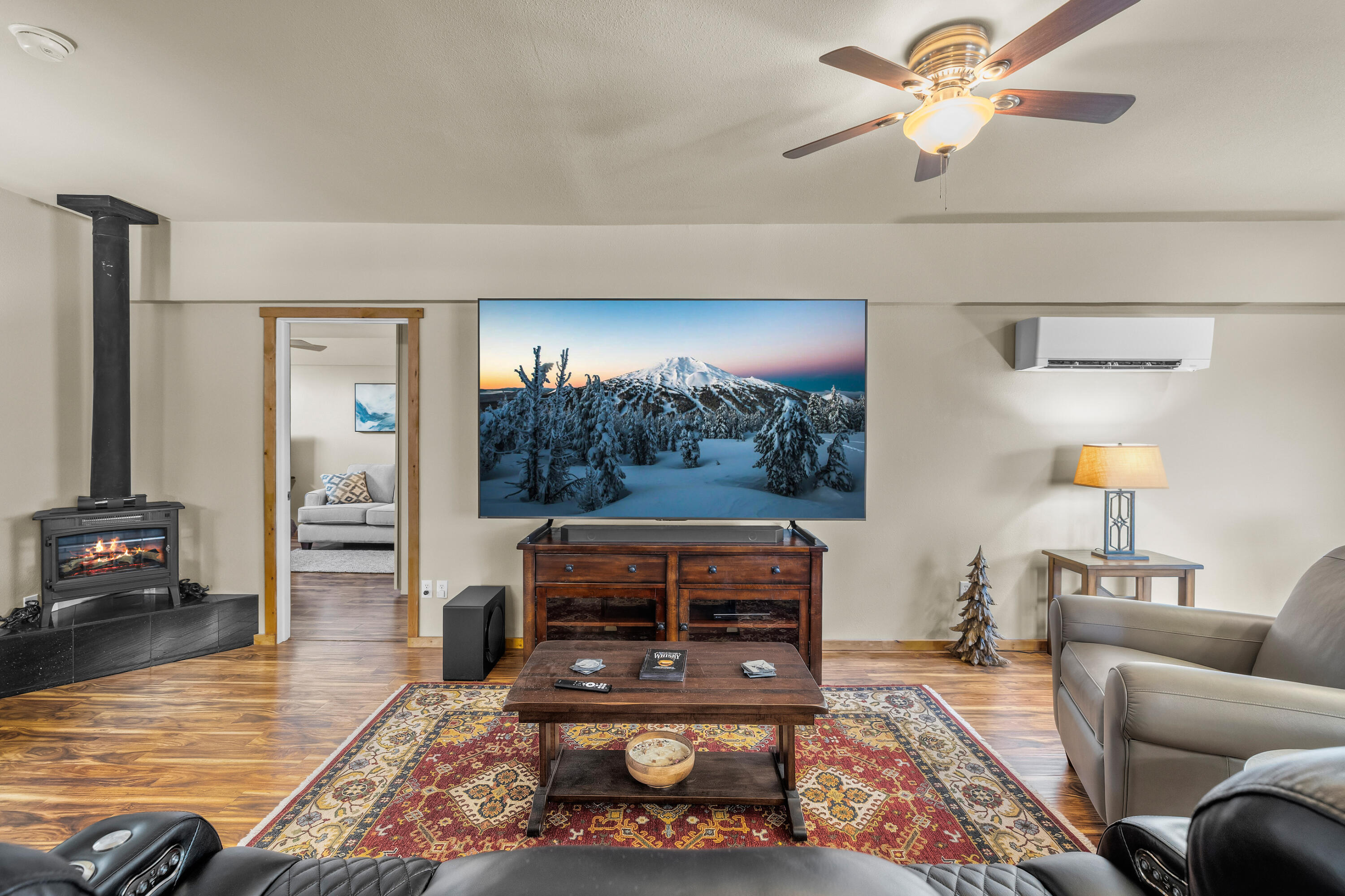 64145 Hunnell Road Bend, OR 97703 - Photo 56 of 65 A spacious central living area anchors the finished upper-level guest/flex quarters, with access to three separate rooms and a full bath for flexible use as guest space, office, hobbies or extended-stay accommodations.