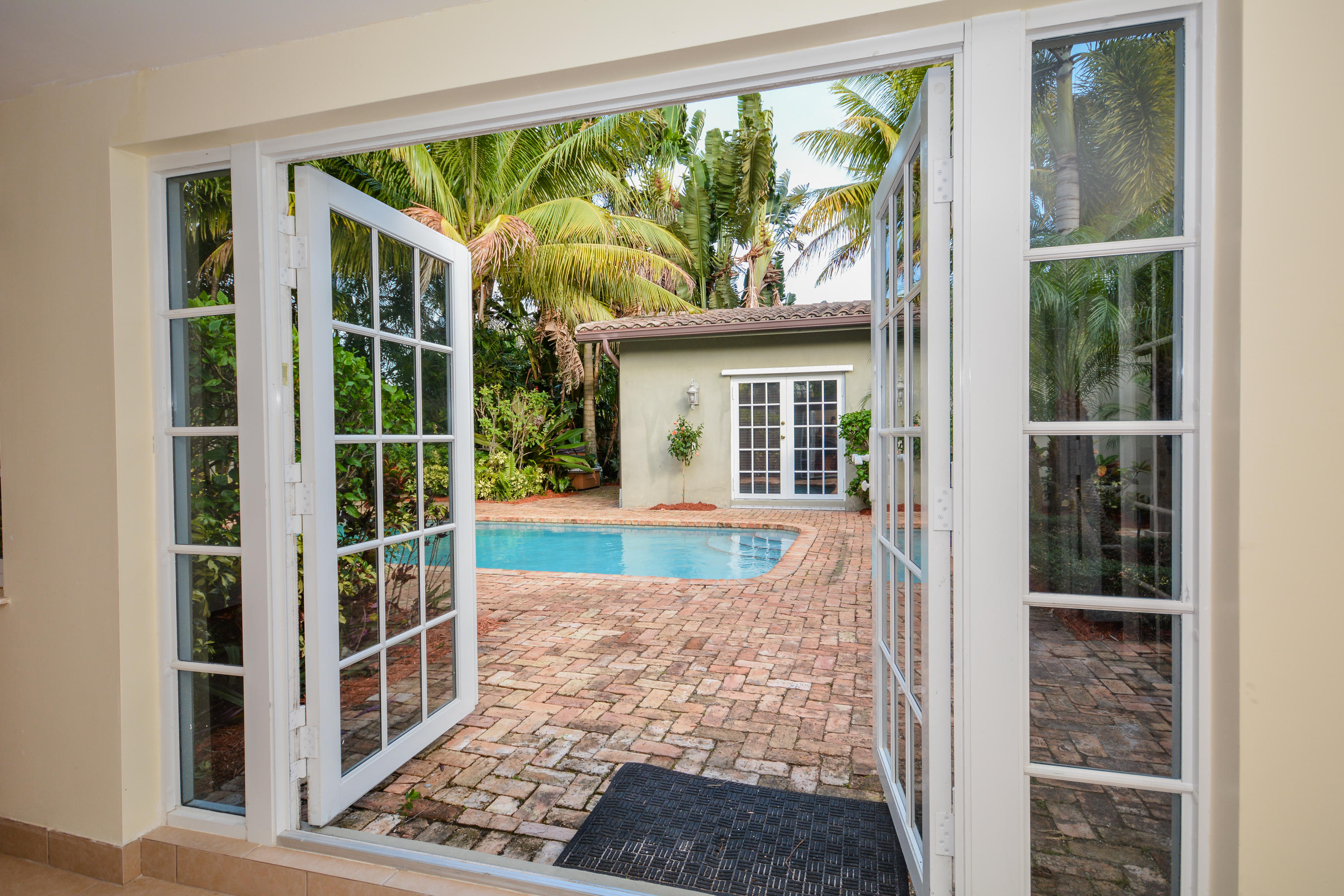225 Northeast 4th Street Boca Raton, FL 33432 - Photo 11 of 22 Playroom Looking out at pool