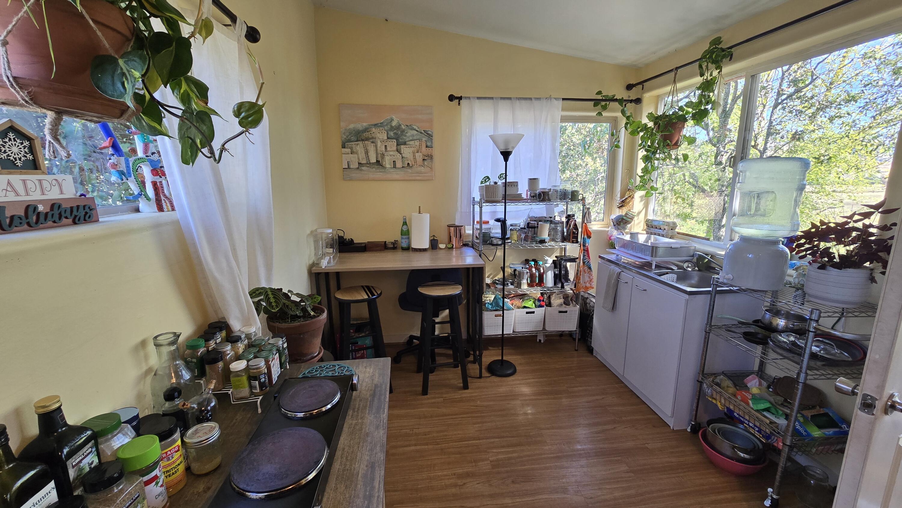 488 Crowson Road Ashland, OR 97520 - Photo 25 of 30 a view of a dining room with furniture window and wooden floor