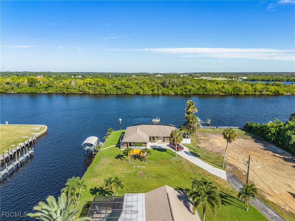 2193 River Road Fort Myers, FL 33905 - Photo 9 of 19 a view of a lake with a house in the background