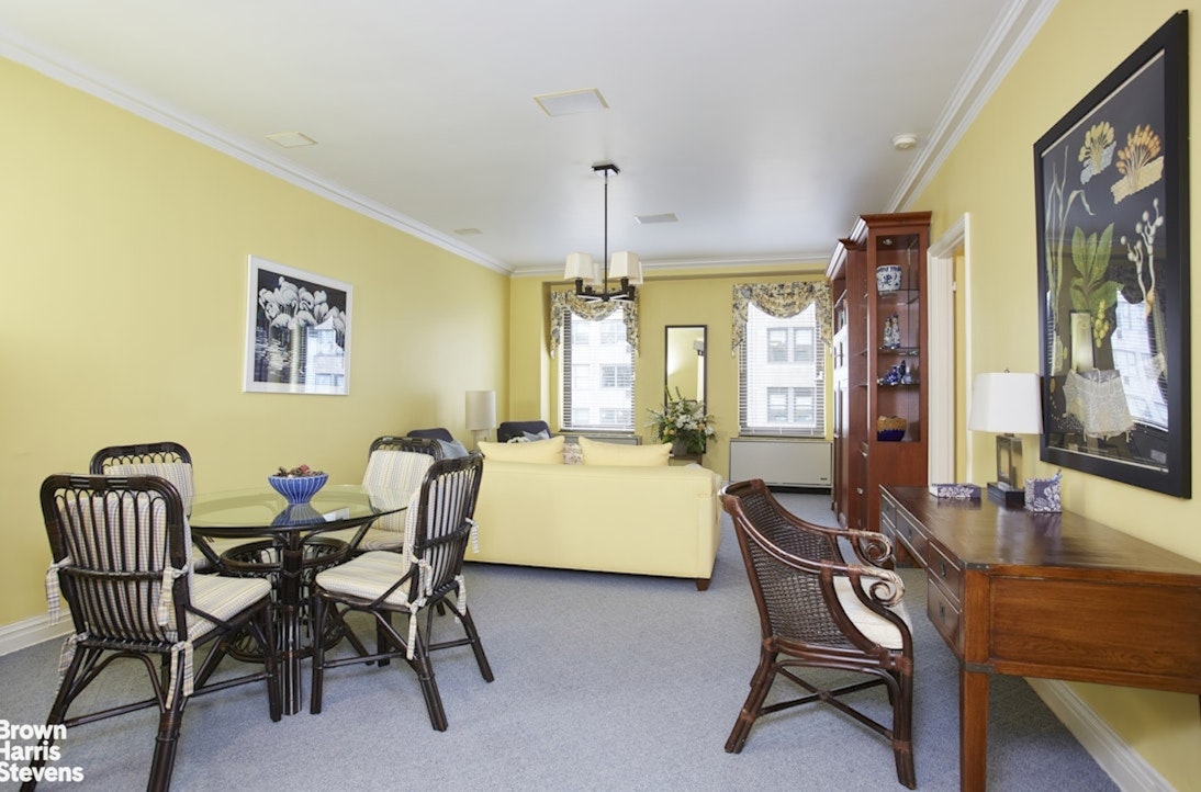 a dining room with furniture and window