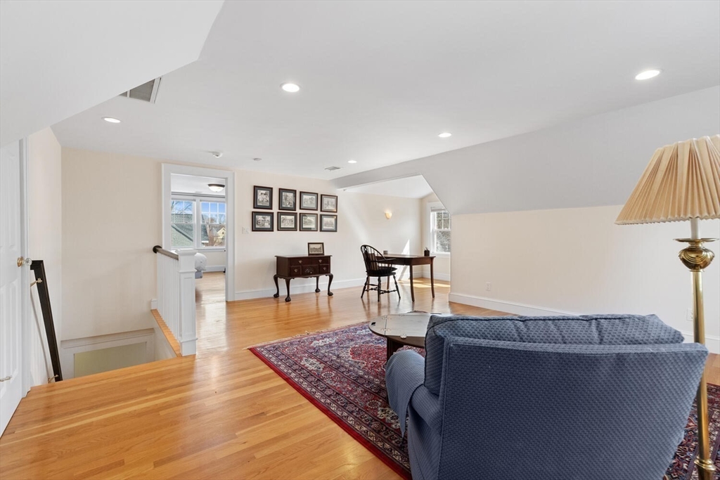 209 Waltham Street Lexington, MA 02421 - Photo 27 of 39 a living room with furniture and a wooden floor