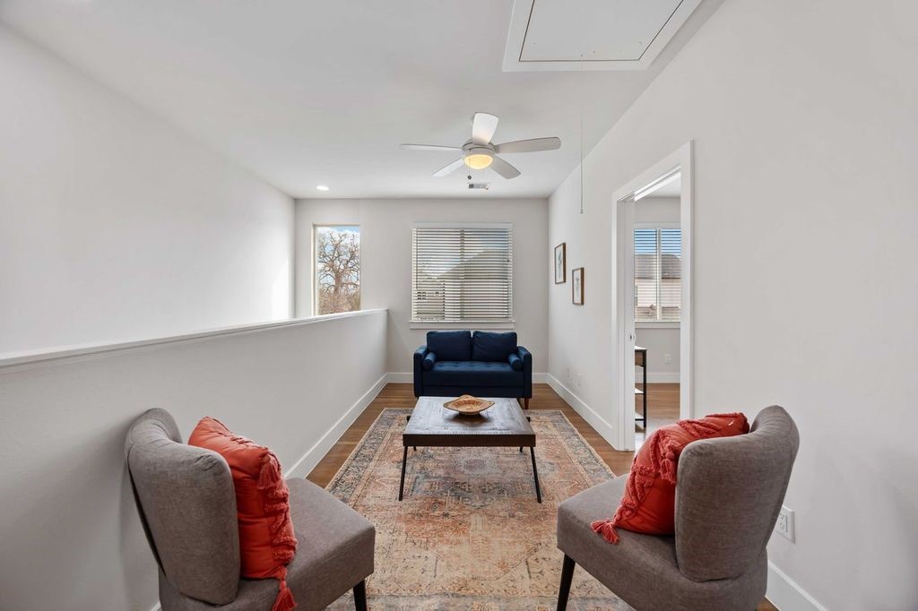 2314 Gagne Street Houston, TX 77020 - Photo 11 of 28 a living room with furniture stairs and a window