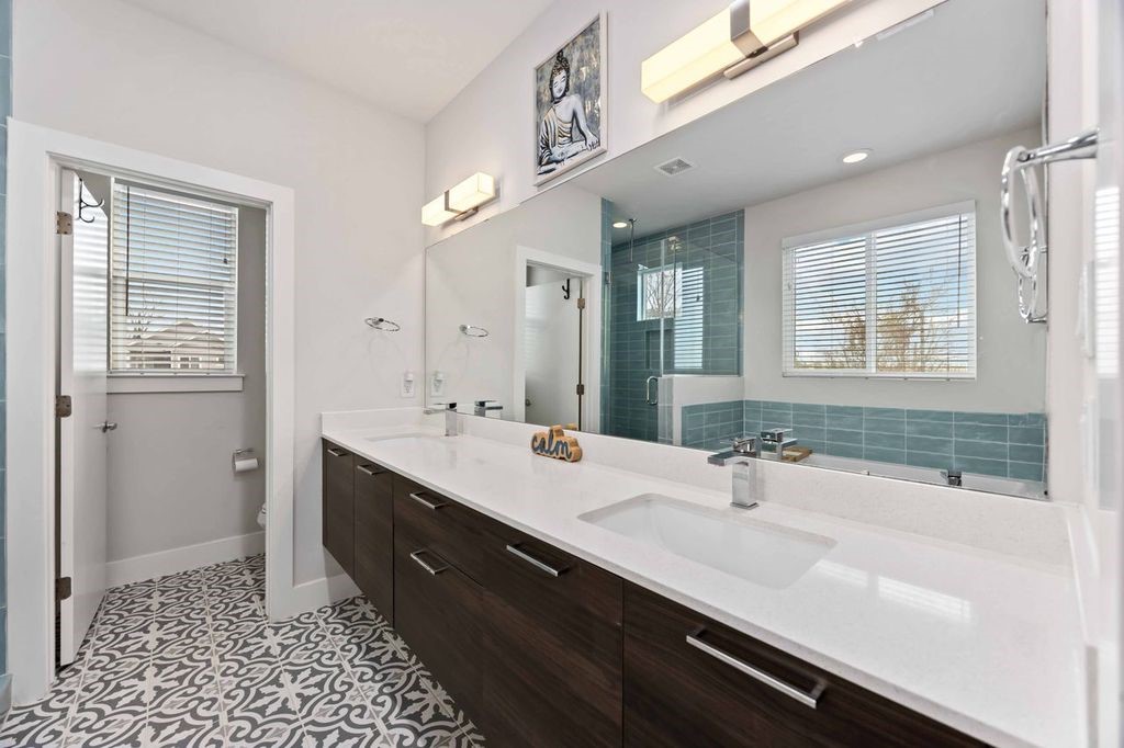 2314 Gagne Street Houston, TX 77020 - Photo 15 of 28 a bathroom with a sink double vanity and a shower