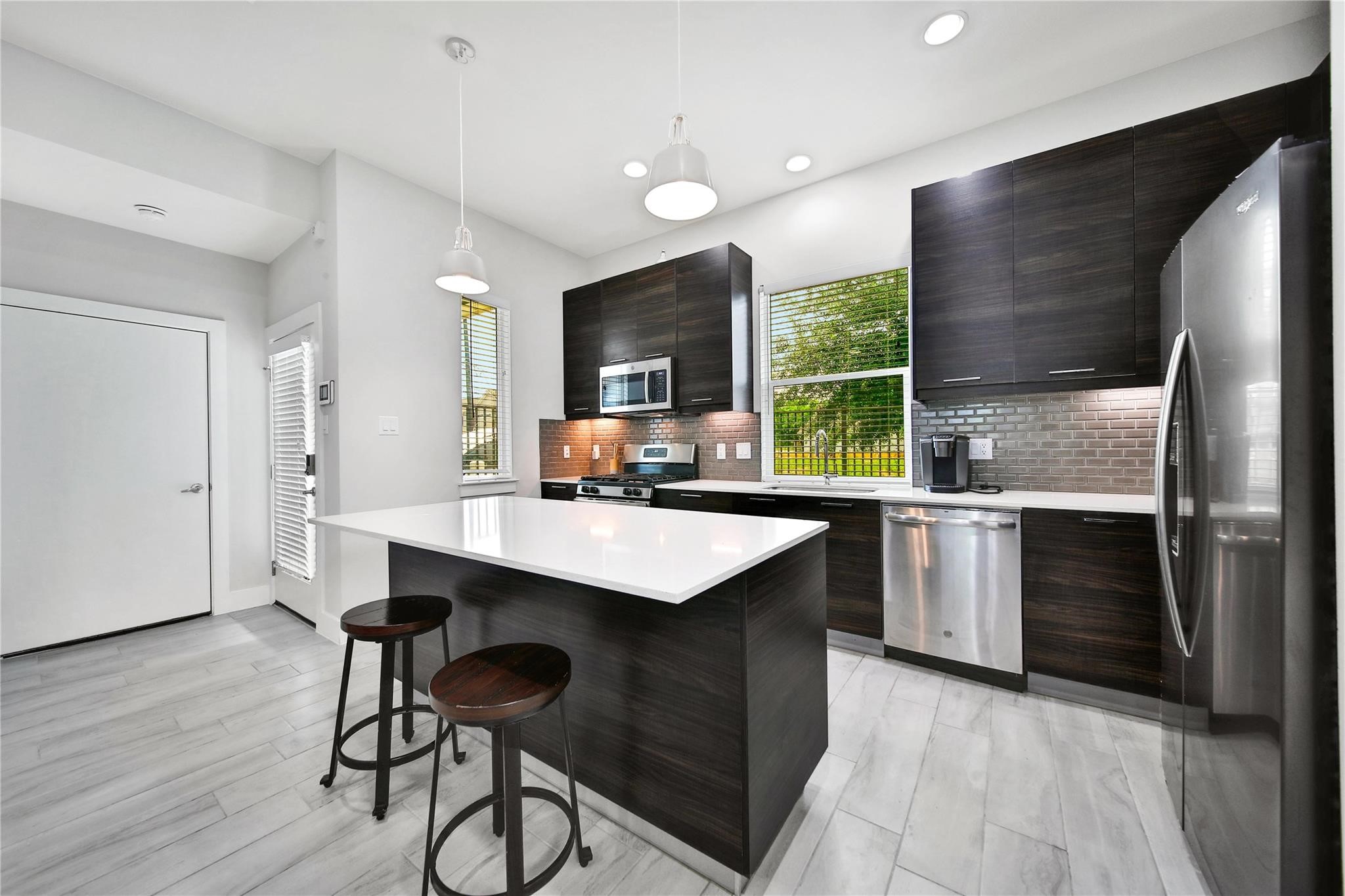 2314 Gagne Street Houston, TX 77020 - Photo 3 of 28 a kitchen with a sink appliances and cabinets