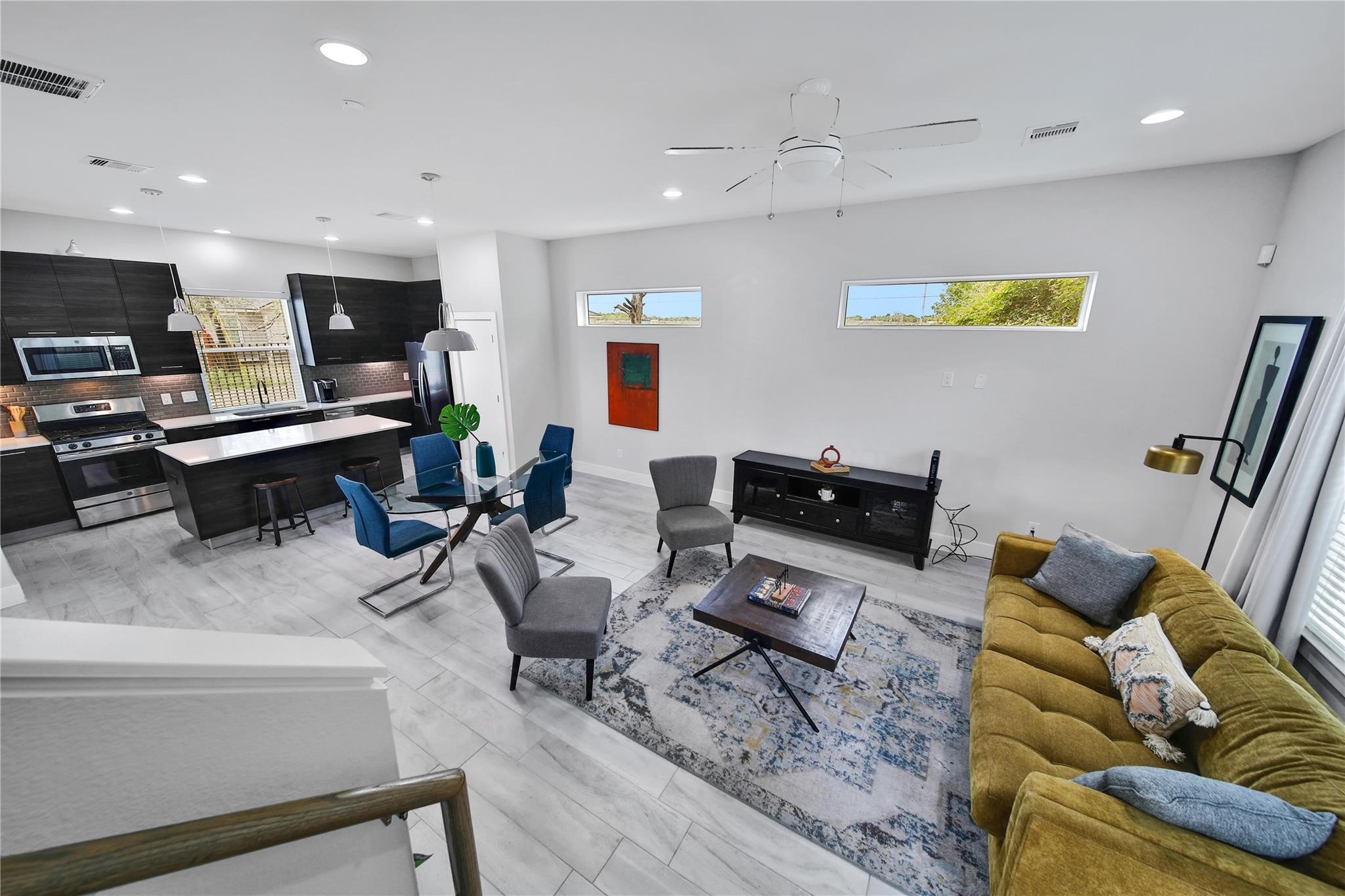 2314 Gagne Street Houston, TX 77020 - Photo 6 of 28 a living room with furniture and a flat screen tv