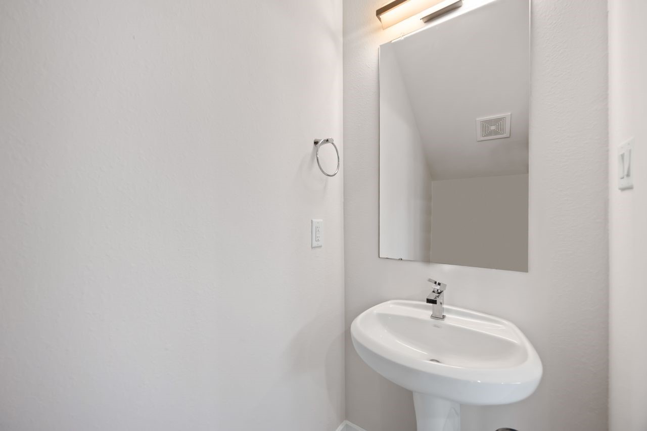 2314 Gagne Street Houston, TX 77020 - Photo 9 of 28 a bathroom with a sink and a mirror