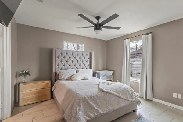 a bedroom with a large bed and a window