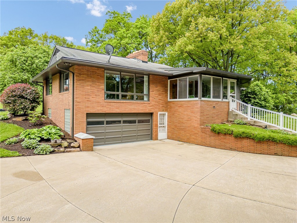 1010 Knollwood Road Northwest Canton, OH 44708 - Photo 38 of 47 View of front facade featuring a garage