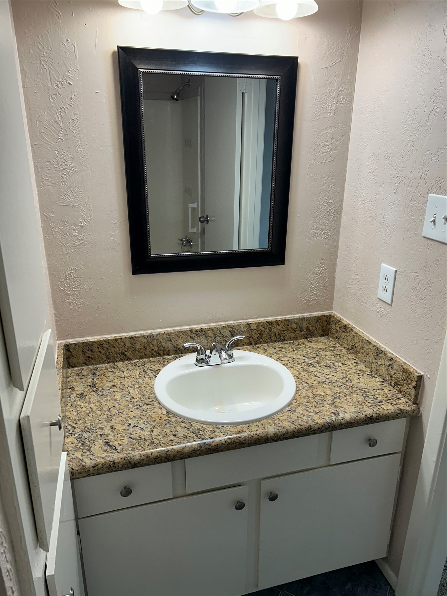 20333 Fieldtree Drive Humble, TX 77338 - Photo 18 of 23 a bathroom with a granite countertop sink and a mirror