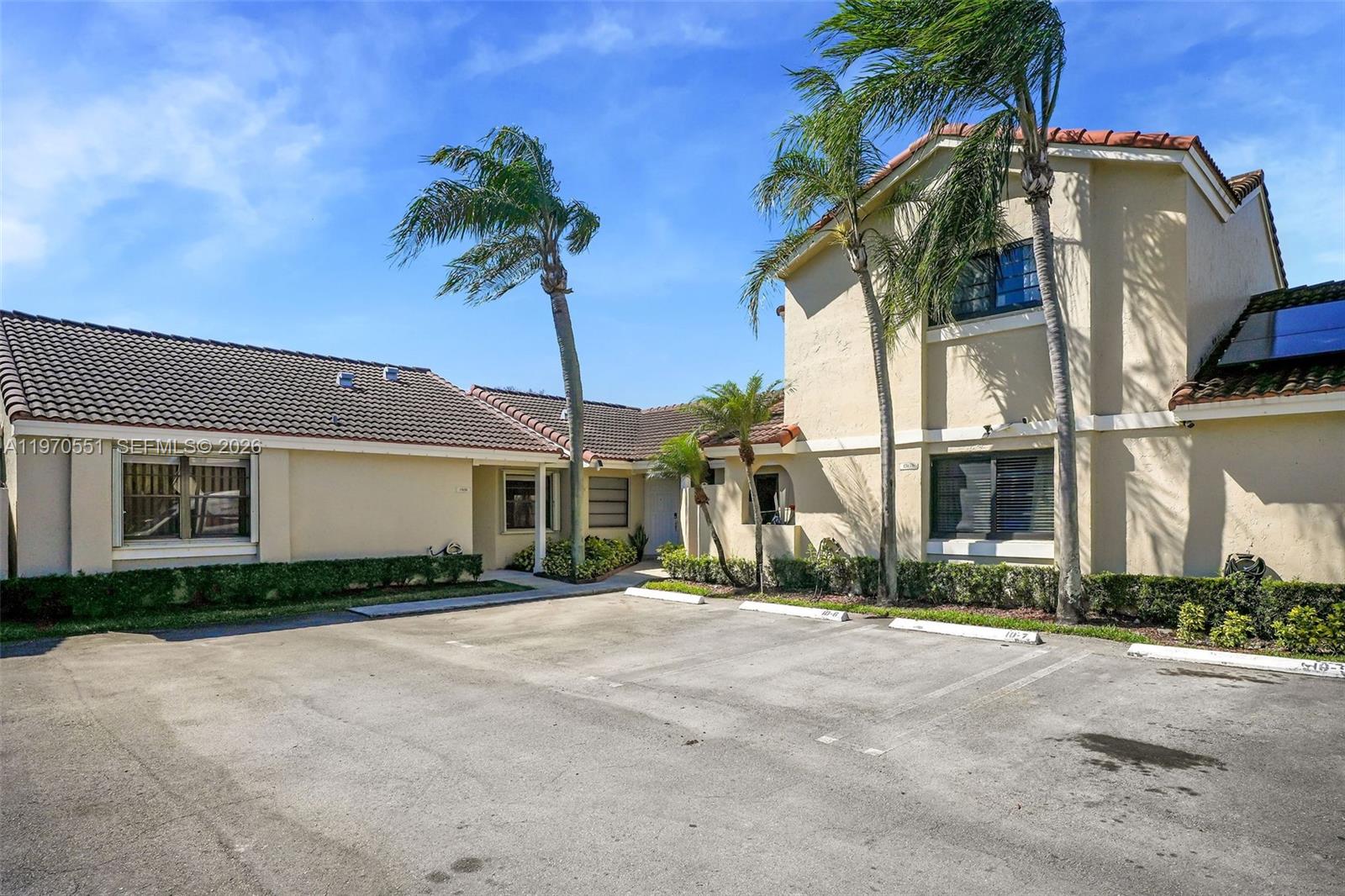 17032 Northwest 63rd Place Hialeah, FL 33015 - Photo 13 of 13 a front view of house with yard and trees around
