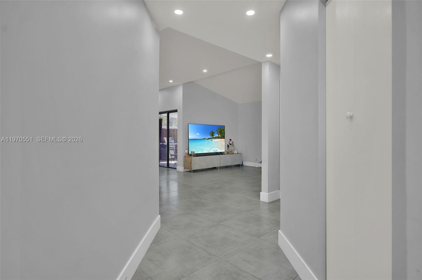 17032 Northwest 63rd Place Hialeah, FL 33015 - Photo 6 of 13 a view of a hallway with seating area