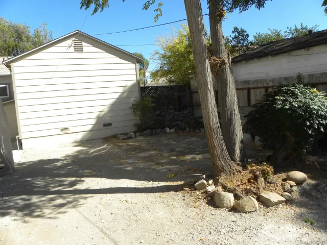 a view of a backyard of the house