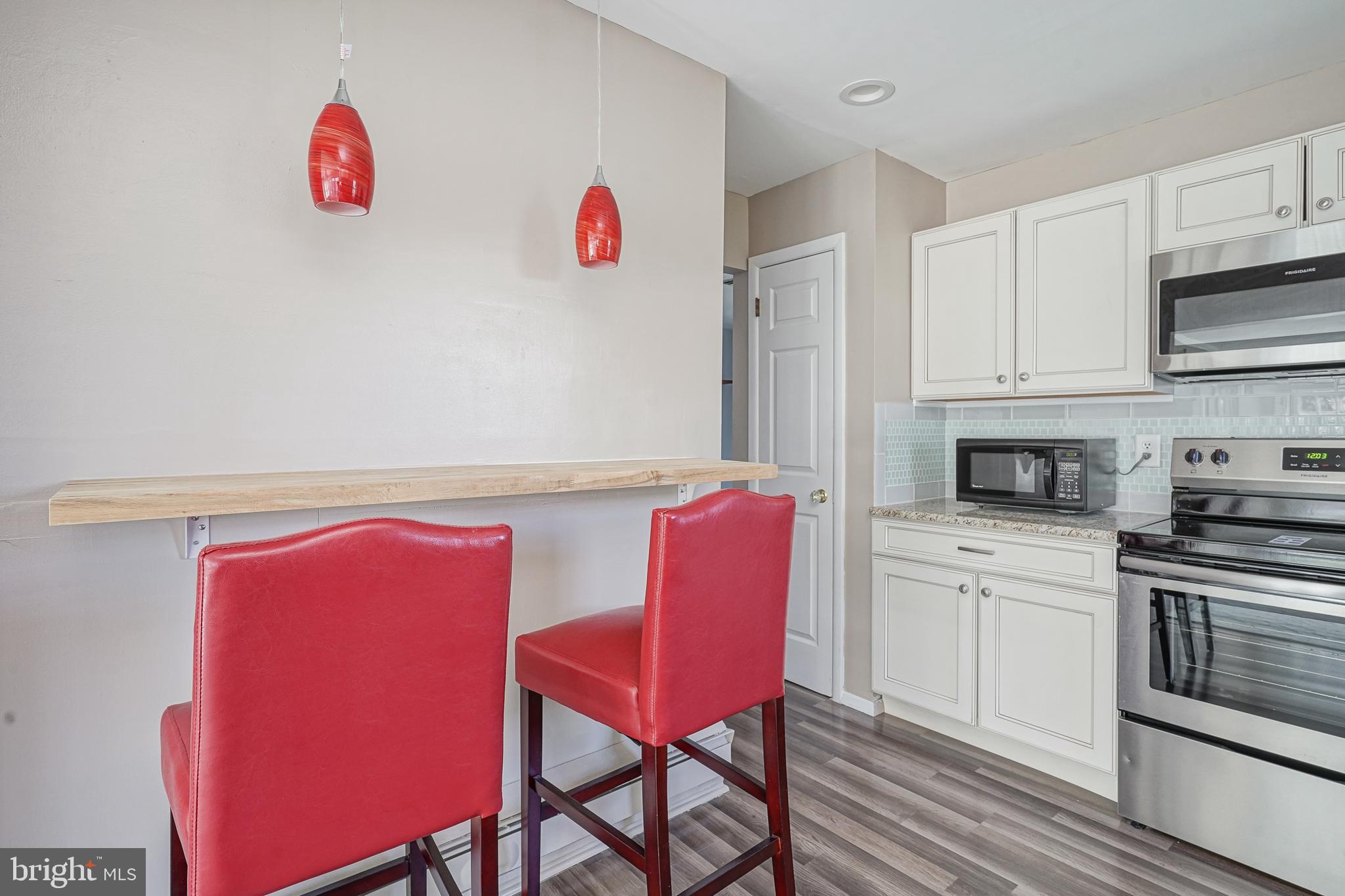 30 Buckingham Drive Southampton, NJ 08088 - Photo 11 of 24 a kitchen with stainless steel appliances granite countertop a stove top oven a sink and dishwasher