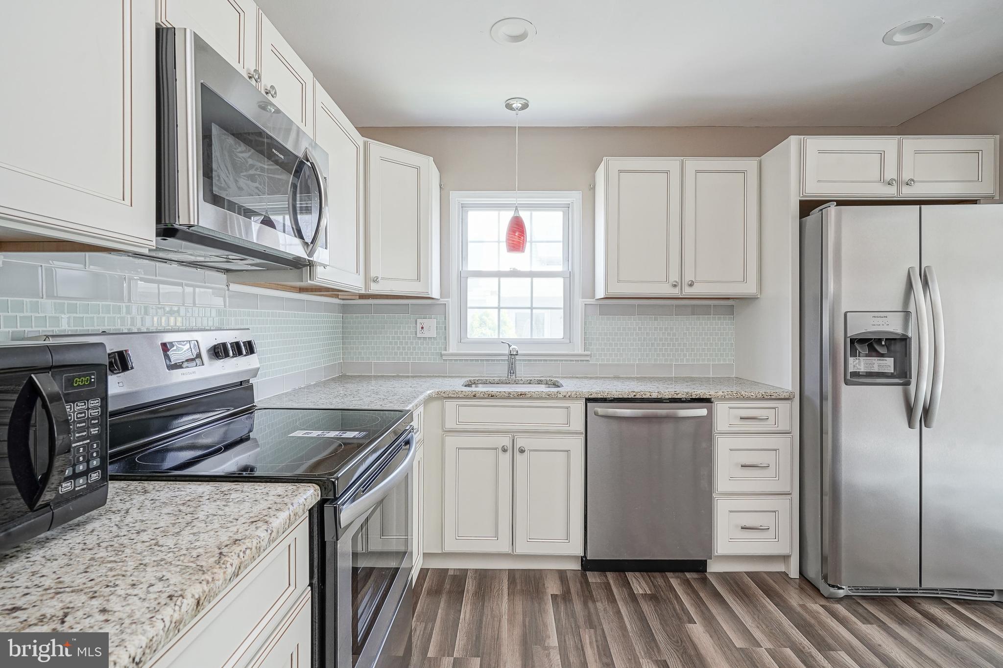 30 Buckingham Drive Southampton, NJ 08088 - Photo 12 of 24 a kitchen with a sink stove and refrigerator