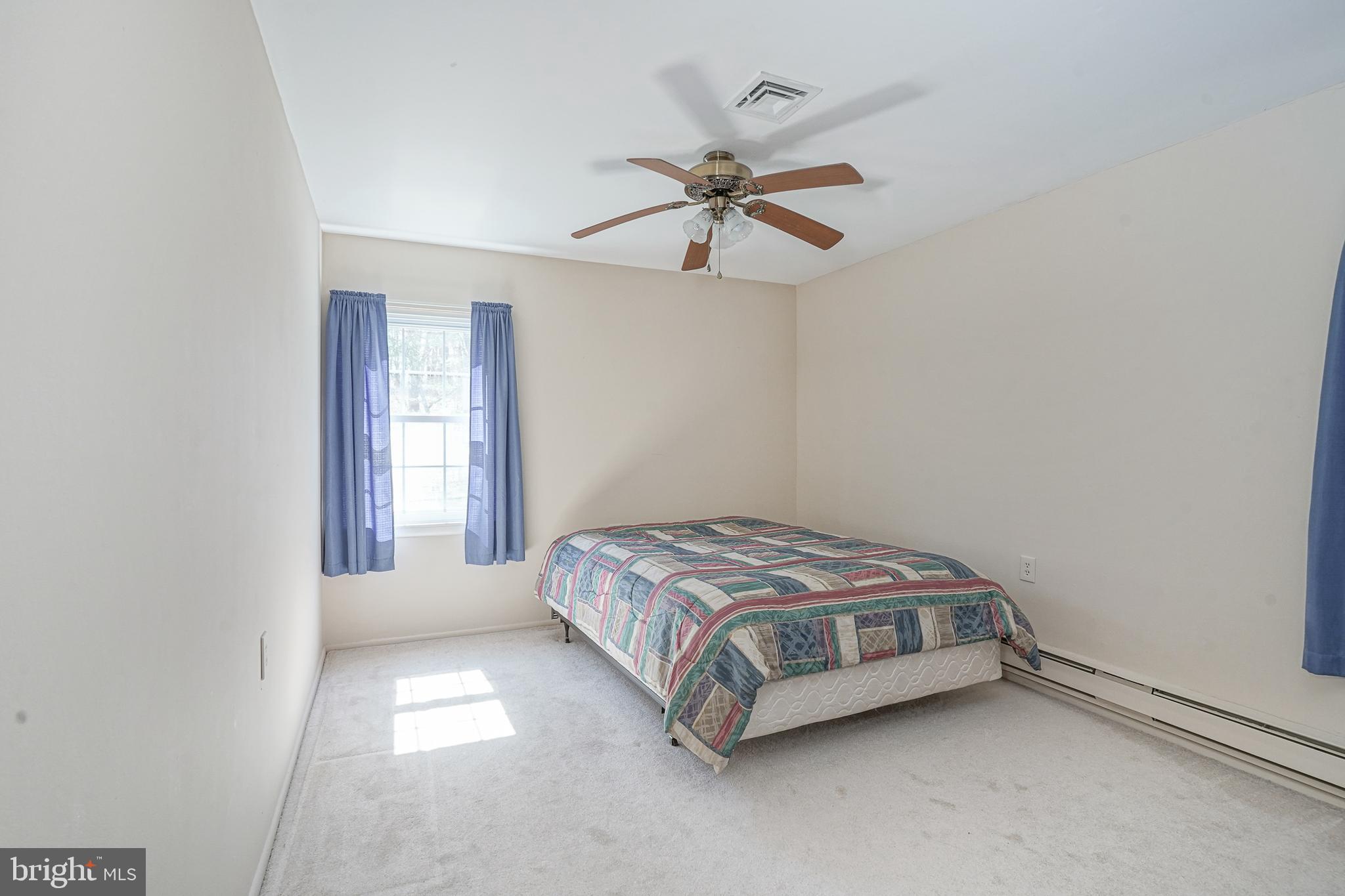 30 Buckingham Drive Southampton, NJ 08088 - Photo 15 of 24 a spacious bedroom with a bed and window