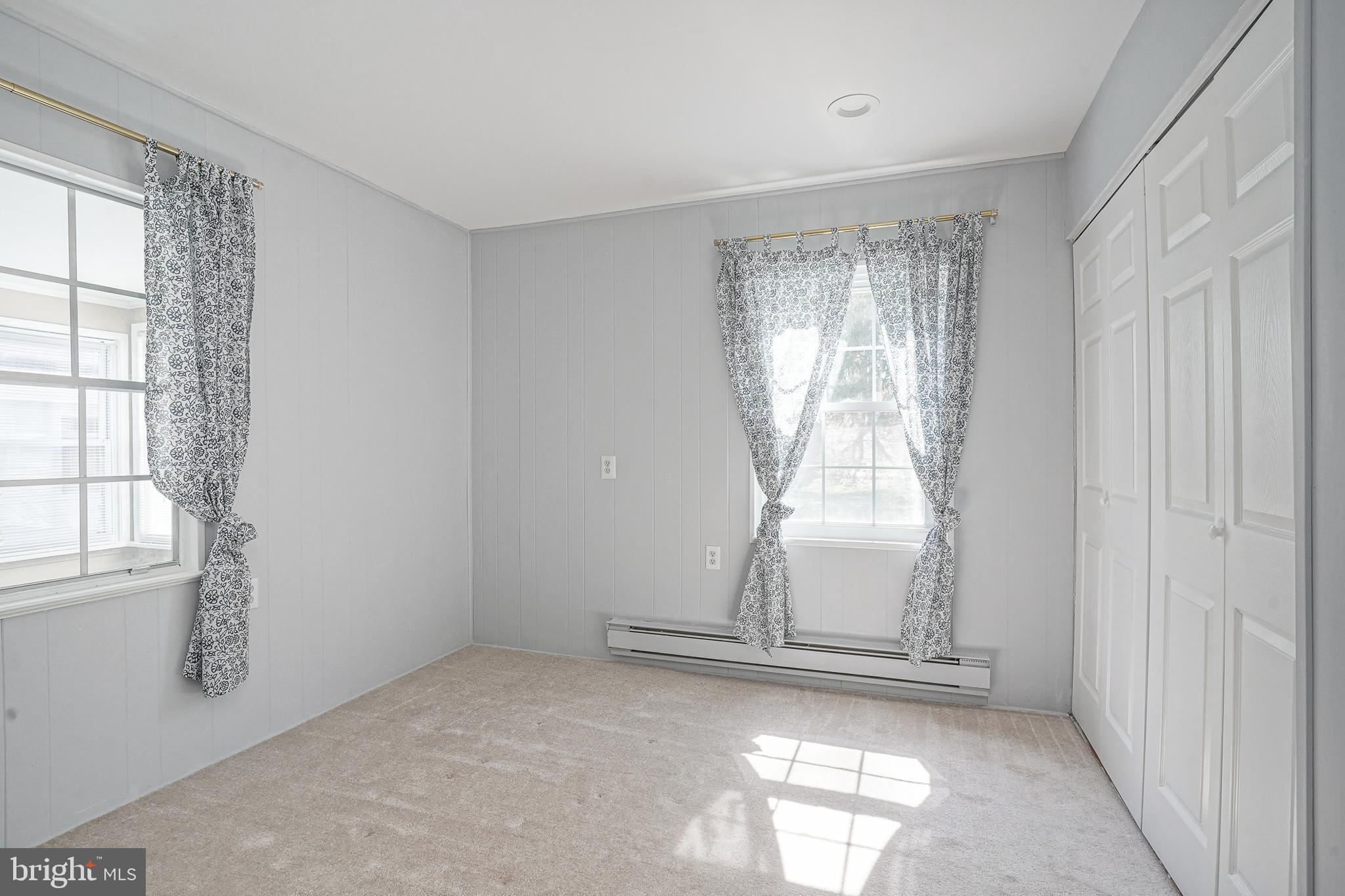 30 Buckingham Drive Southampton, NJ 08088 - Photo 16 of 24 a view of empty room with wooden floor and fan