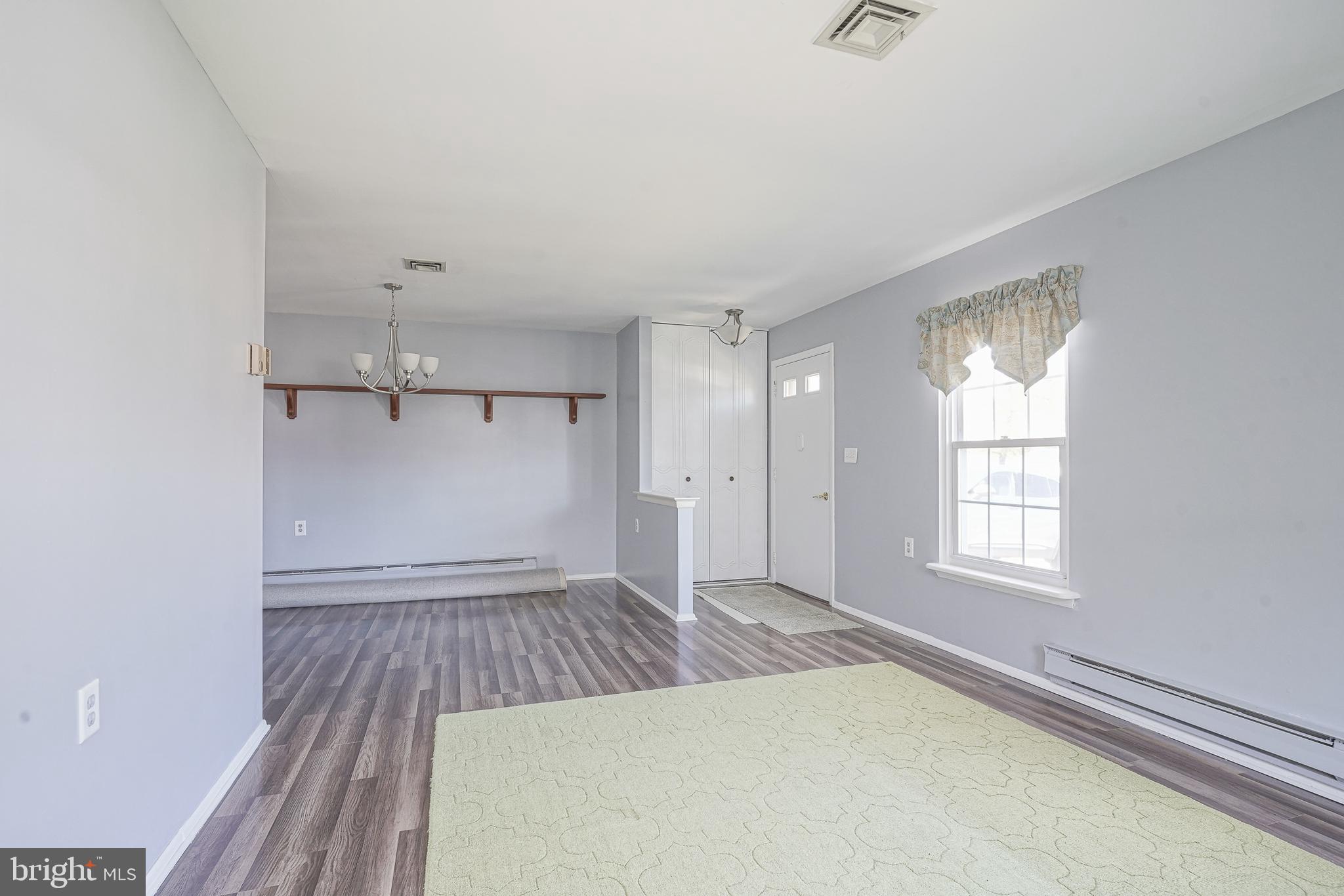 30 Buckingham Drive Southampton, NJ 08088 - Photo 6 of 24 an empty room with wooden floor and windows