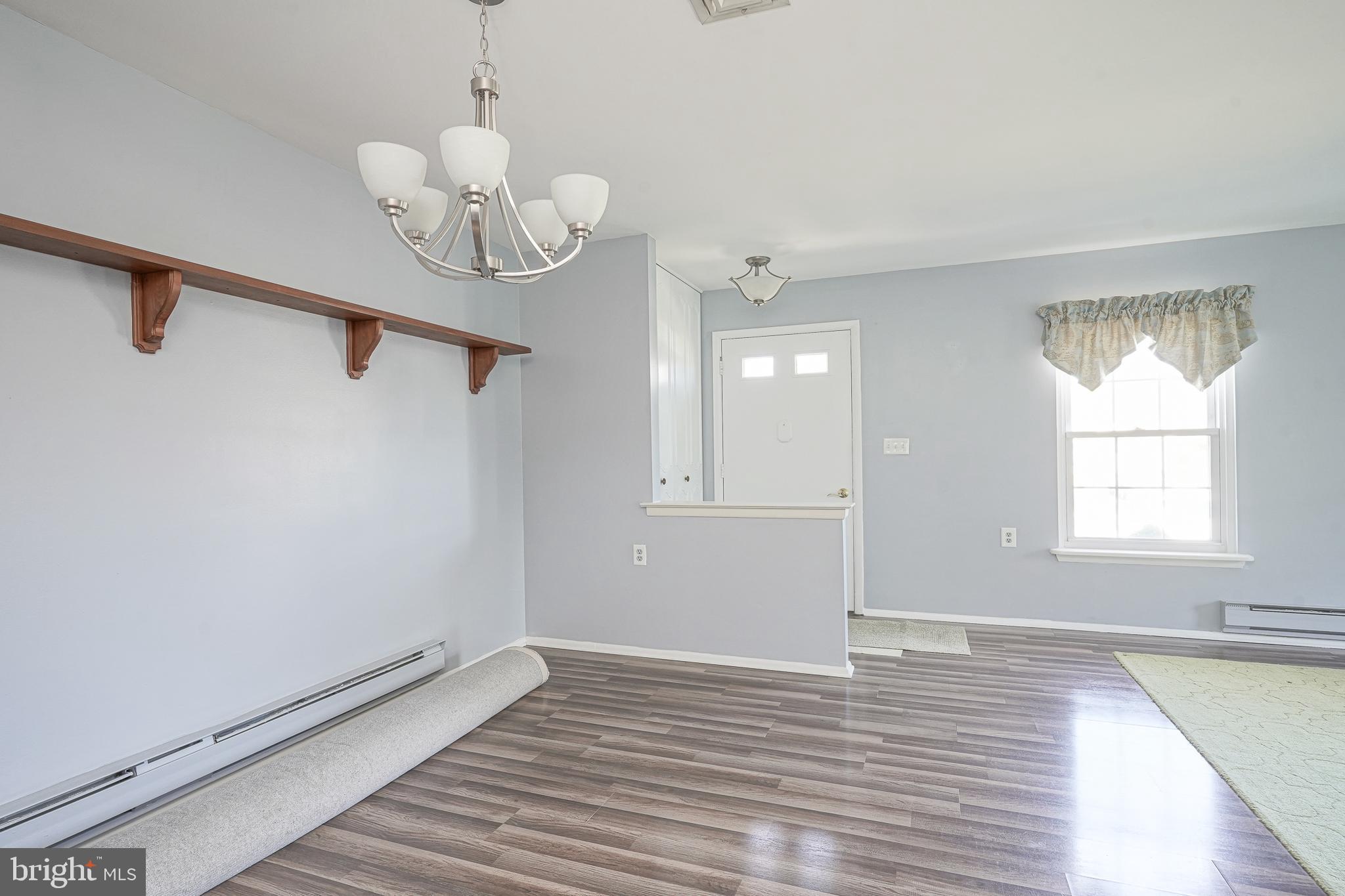30 Buckingham Drive Southampton, NJ 08088 - Photo 8 of 24 a view of an empty room with wooden floor and a window