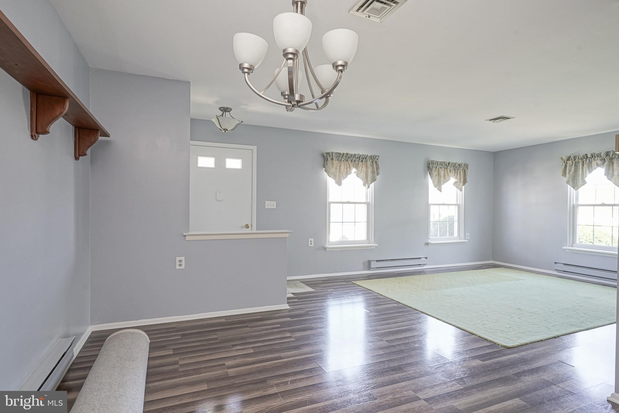 30 Buckingham Drive Southampton, NJ 08088 - Photo 9 of 24 a view of an empty room with wooden floor and a window