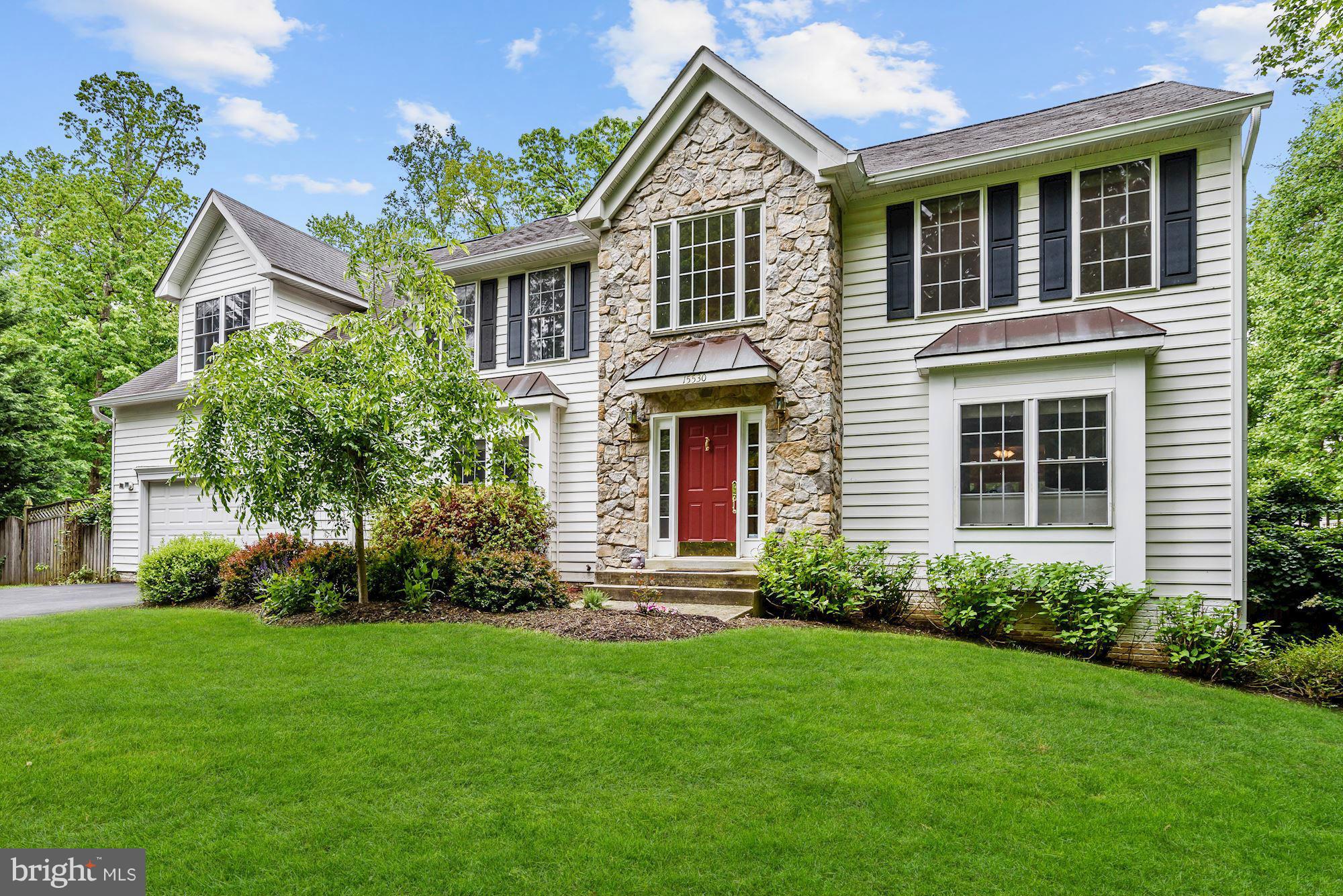 15530 Thompson Road Silver Spring, MD 20905 - Photo 2 of 30 a front view of a house with a yard and plants