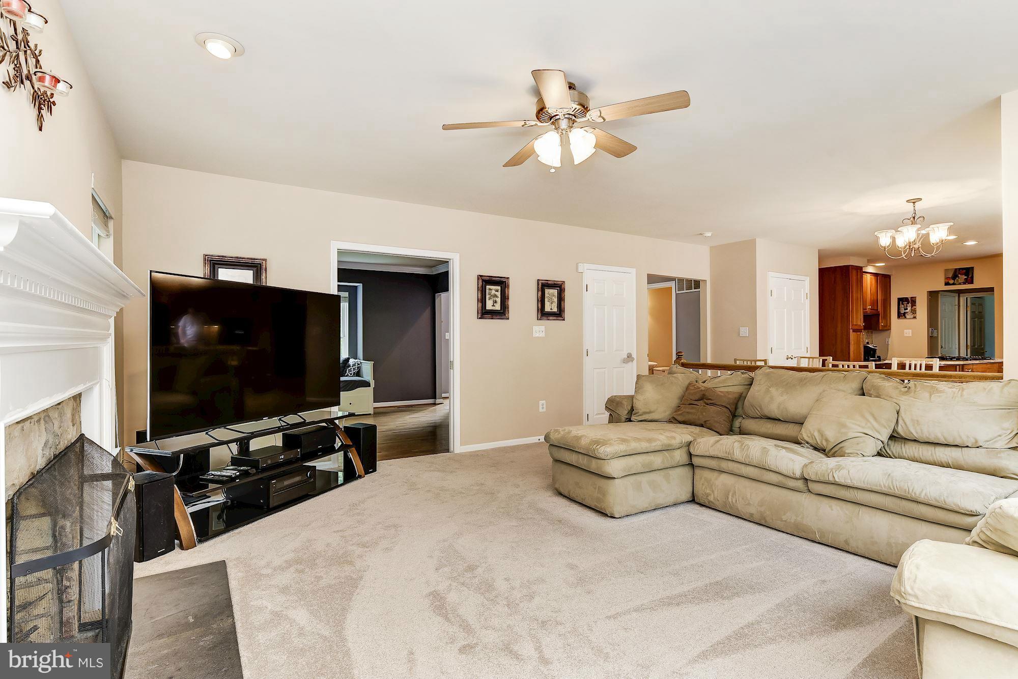 15530 Thompson Road Silver Spring, MD 20905 - Photo 12 of 30 a living room with furniture and a flat screen tv