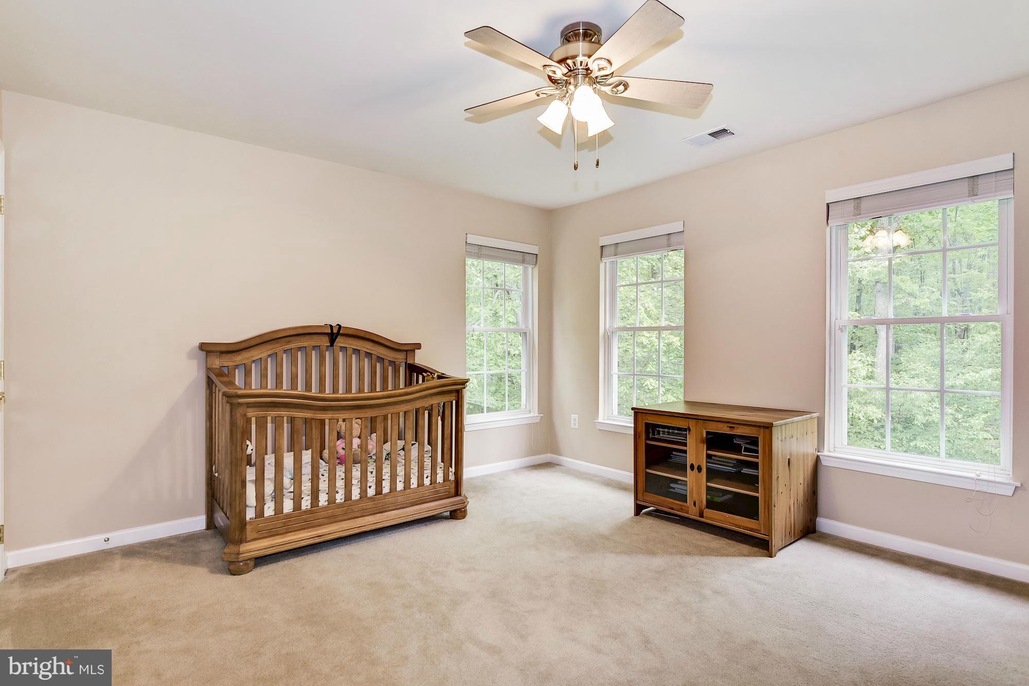 15530 Thompson Road Silver Spring, MD 20905 - Photo 19 of 30 a view of livingroom with furniture windows and a chandelier fan