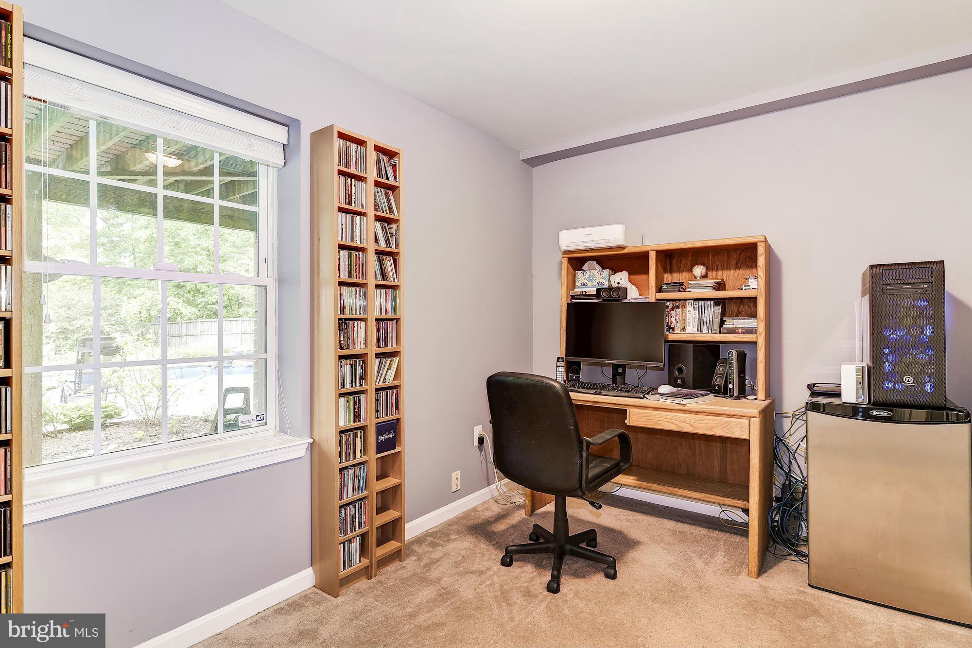 15530 Thompson Road Silver Spring, MD 20905 - Photo 25 of 30 a view of a workspace with furniture and a window